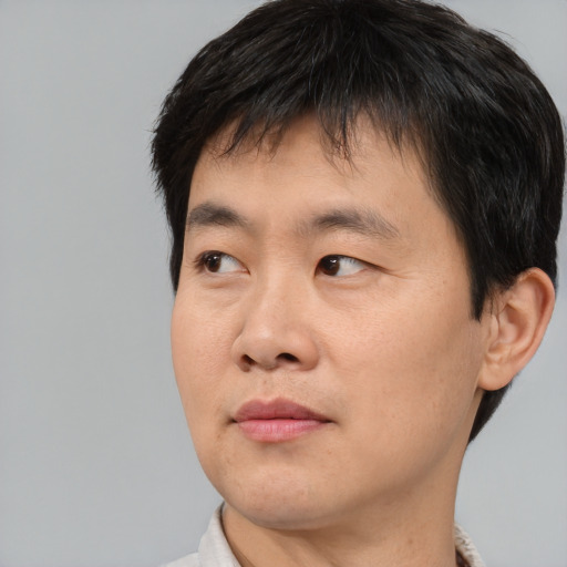 Neutral asian young-adult male with short  black hair and brown eyes