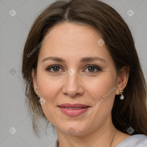 Joyful white adult female with medium  brown hair and grey eyes