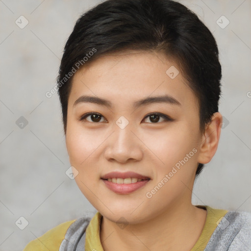 Joyful asian young-adult female with short  brown hair and brown eyes