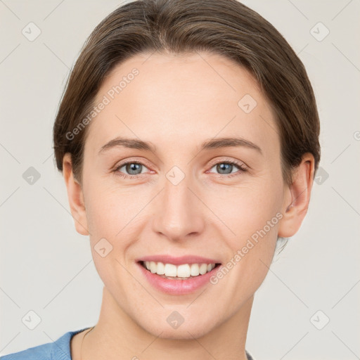 Joyful white young-adult female with short  brown hair and grey eyes