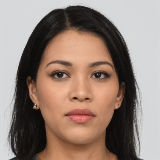 Joyful asian young-adult female with long  brown hair and brown eyes
