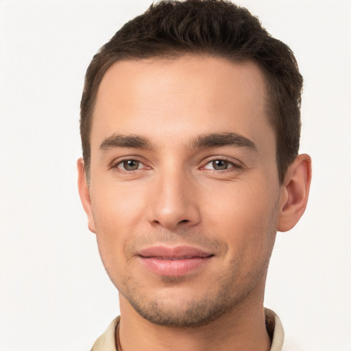 Joyful white young-adult male with short  brown hair and brown eyes