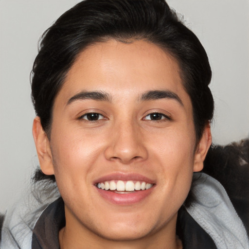 Joyful white young-adult female with medium  brown hair and brown eyes