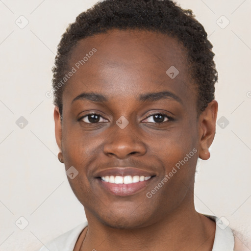 Joyful black young-adult female with short  brown hair and brown eyes