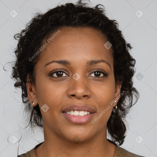 Joyful black young-adult female with medium  brown hair and brown eyes