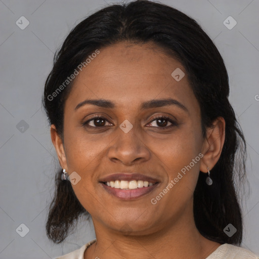 Joyful black young-adult female with medium  black hair and brown eyes