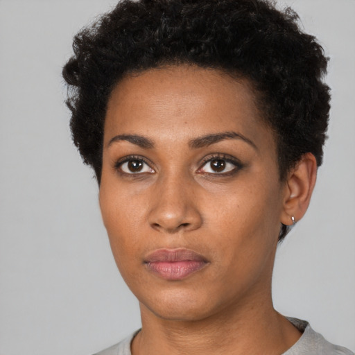 Neutral black young-adult female with short  brown hair and brown eyes