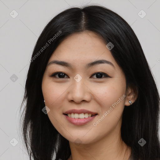 Joyful asian young-adult female with long  black hair and brown eyes