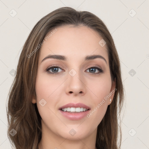 Joyful white young-adult female with long  brown hair and grey eyes