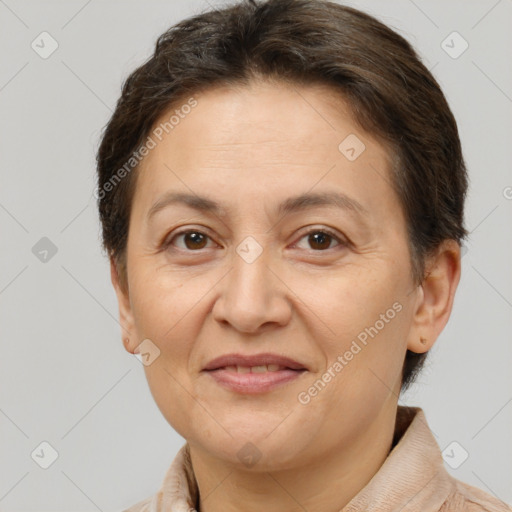 Joyful white adult female with short  brown hair and brown eyes