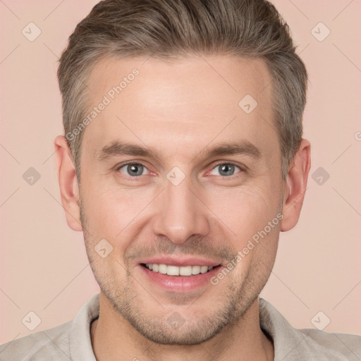 Joyful white adult male with short  brown hair and brown eyes