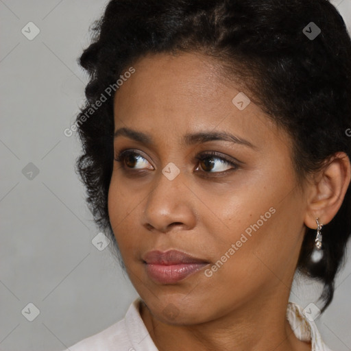 Neutral black young-adult female with medium  brown hair and brown eyes