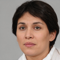 Joyful white adult female with medium  brown hair and brown eyes