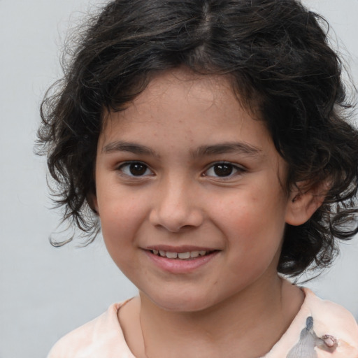 Joyful white child female with medium  brown hair and brown eyes