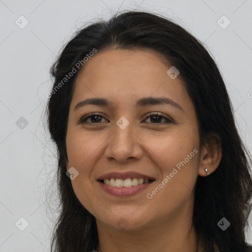 Joyful latino young-adult female with long  brown hair and brown eyes