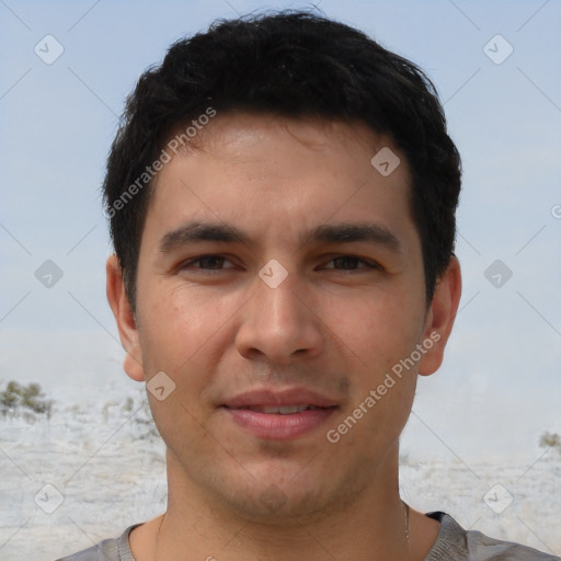 Joyful asian young-adult male with short  brown hair and brown eyes