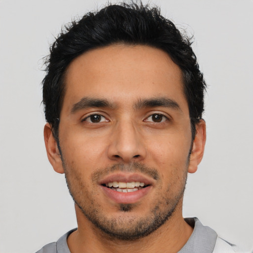 Joyful asian young-adult male with short  black hair and brown eyes