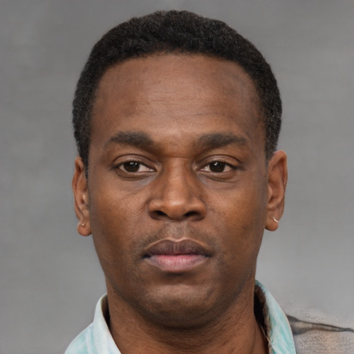 Neutral black young-adult male with short  black hair and brown eyes