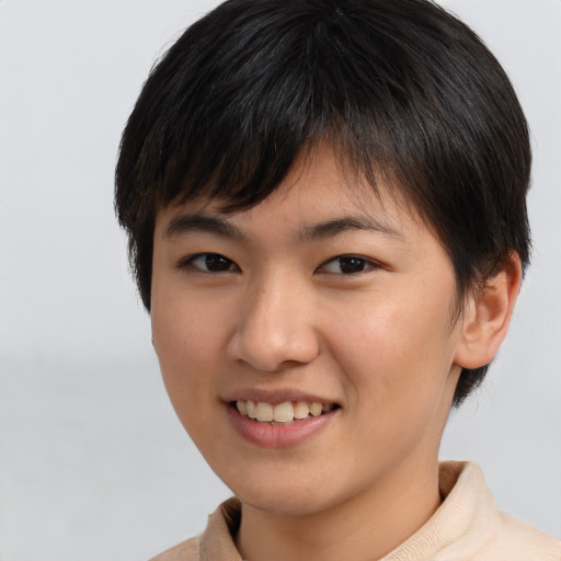 Joyful asian young-adult female with short  brown hair and brown eyes
