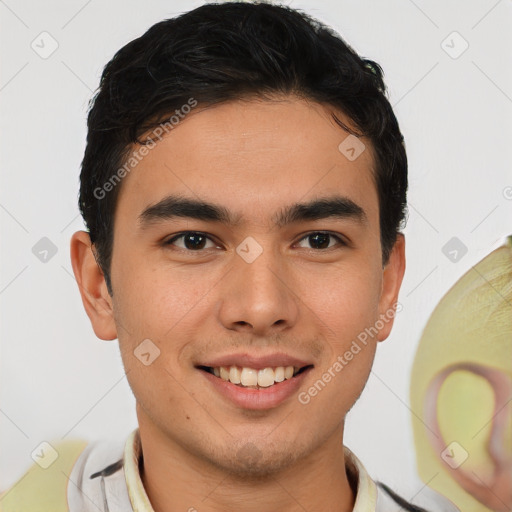 Joyful latino young-adult male with short  brown hair and brown eyes