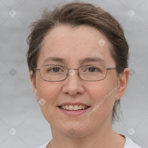 Joyful white adult female with short  brown hair and grey eyes