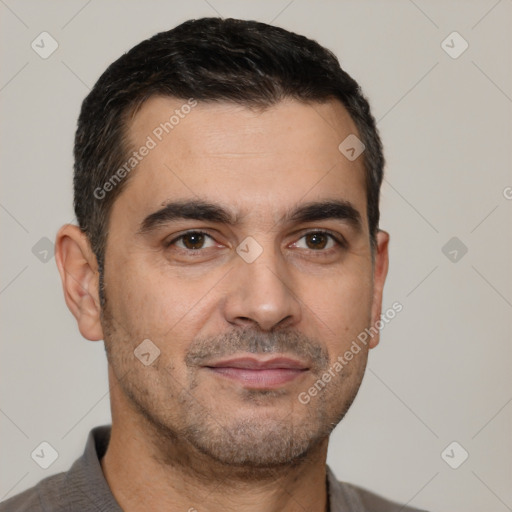 Joyful white young-adult male with short  black hair and brown eyes