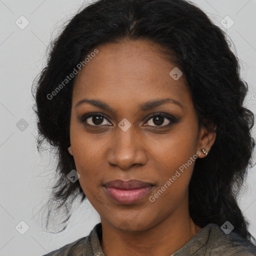 Joyful black young-adult female with long  brown hair and brown eyes