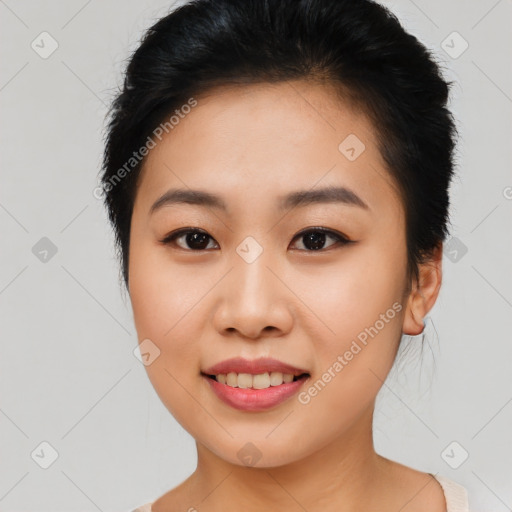 Joyful asian young-adult female with short  black hair and brown eyes