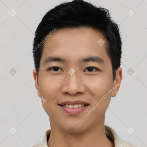 Joyful asian young-adult male with short  black hair and brown eyes