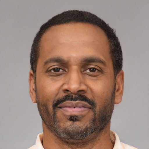Neutral latino adult male with short  brown hair and brown eyes