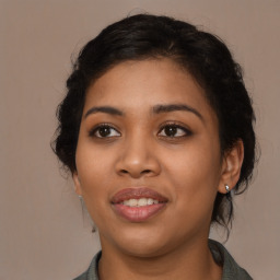 Joyful latino young-adult female with long  brown hair and brown eyes