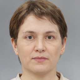 Joyful white adult female with short  brown hair and brown eyes