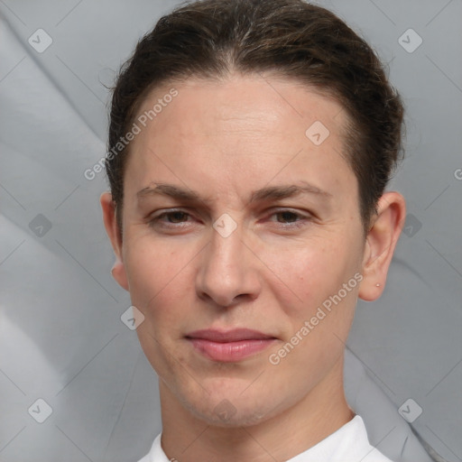 Joyful white adult female with short  brown hair and brown eyes