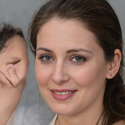 Joyful white adult female with medium  brown hair and brown eyes