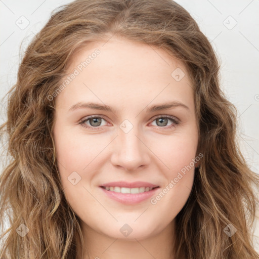 Joyful white young-adult female with long  brown hair and green eyes