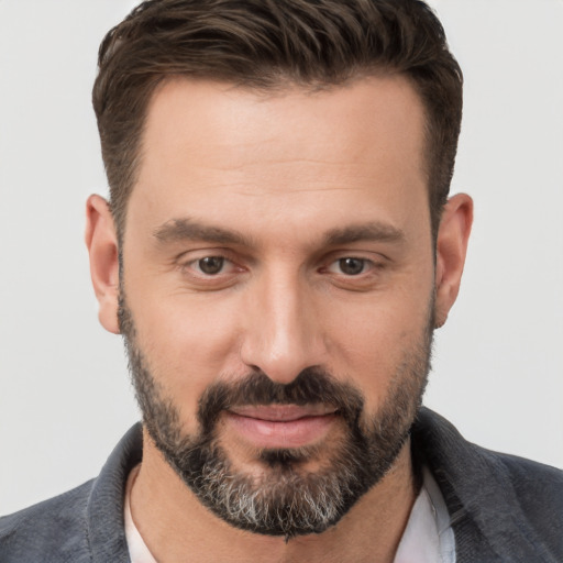 Joyful white adult male with short  brown hair and brown eyes