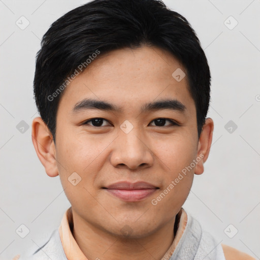 Joyful asian young-adult male with short  black hair and brown eyes