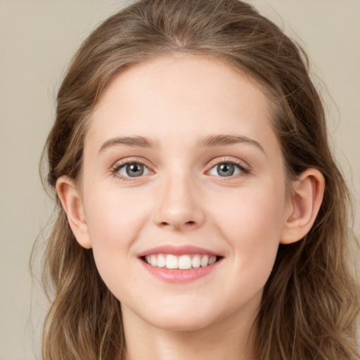 Joyful white young-adult female with long  brown hair and blue eyes