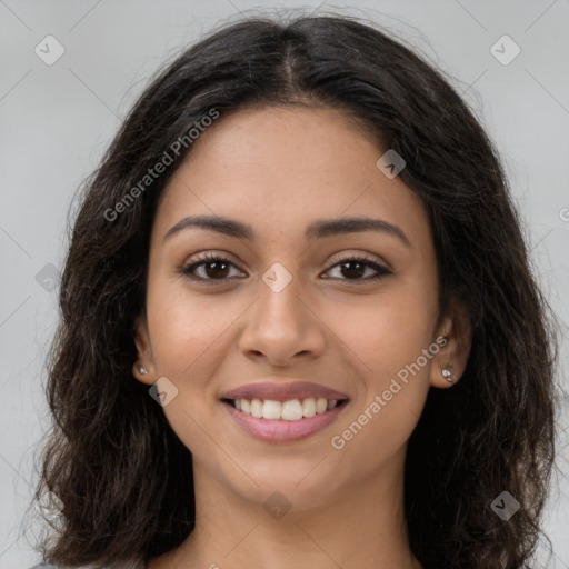 Joyful latino young-adult female with long  brown hair and brown eyes