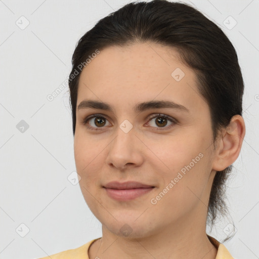 Joyful white young-adult female with medium  brown hair and brown eyes