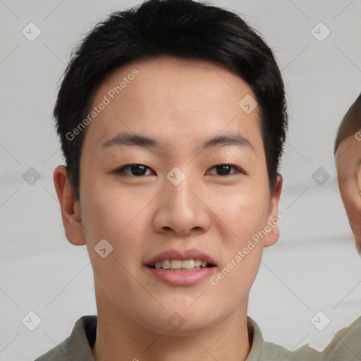 Joyful asian young-adult male with short  brown hair and brown eyes