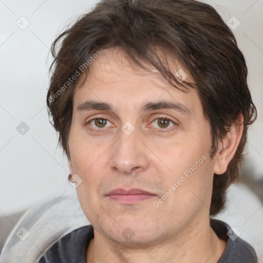 Joyful white adult male with medium  brown hair and brown eyes