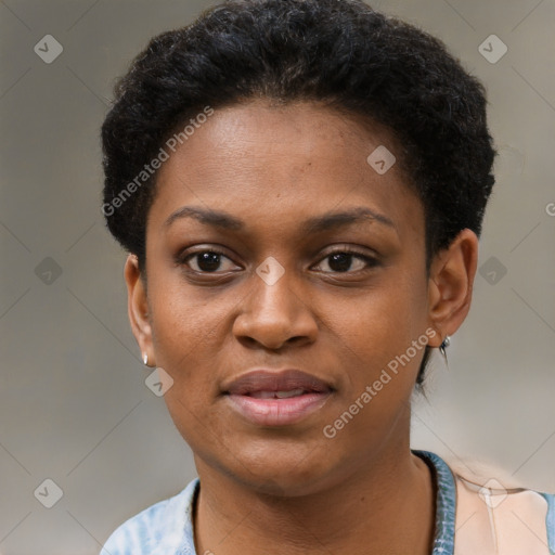 Joyful black young-adult female with short  black hair and brown eyes