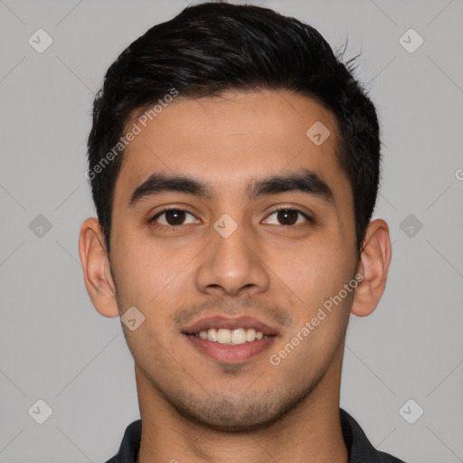 Joyful latino young-adult male with short  black hair and brown eyes