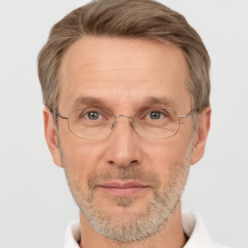 Joyful white adult male with short  brown hair and grey eyes