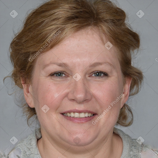 Joyful white adult female with medium  brown hair and blue eyes