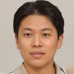 Neutral asian young-adult male with short  brown hair and brown eyes