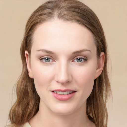 Joyful white young-adult female with long  brown hair and grey eyes