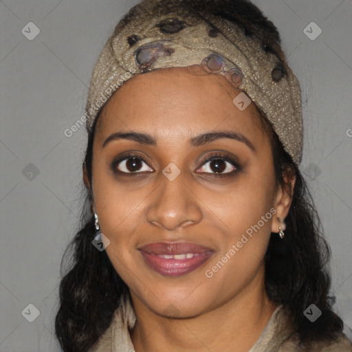 Joyful black young-adult female with long  black hair and brown eyes