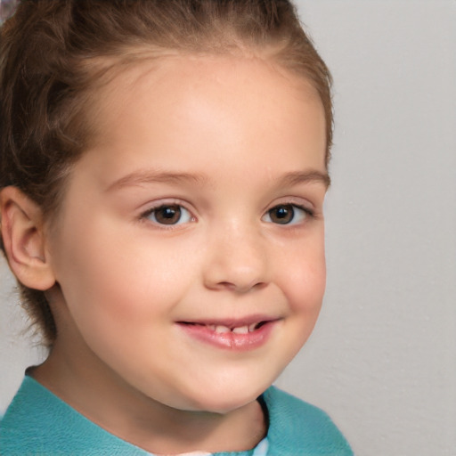 Joyful white child female with short  brown hair and brown eyes